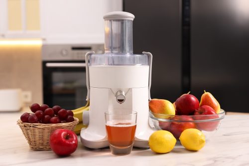 Modern,Juicer,,Fresh,Fruits,And,Glass,On,White,Marble,Table